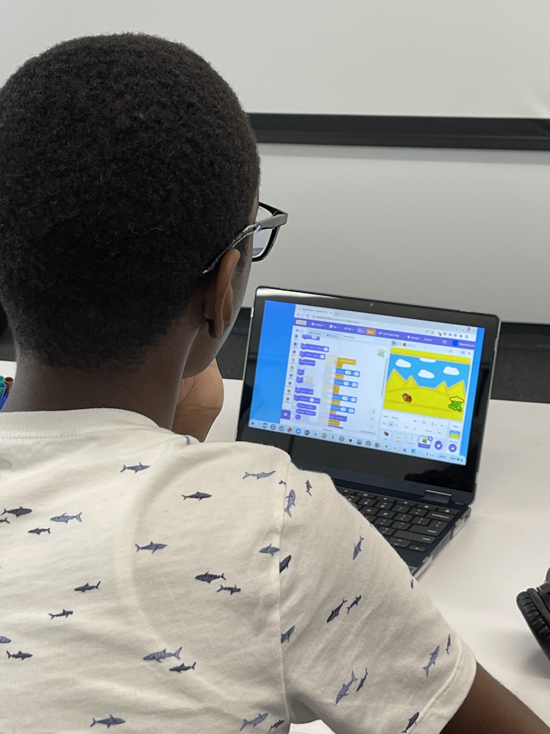 Tech kids student creating his own game